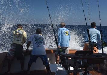 IGFTO Observer Greg Moore watches as the boat backs down on a blue marlin in the Dominican Republic.